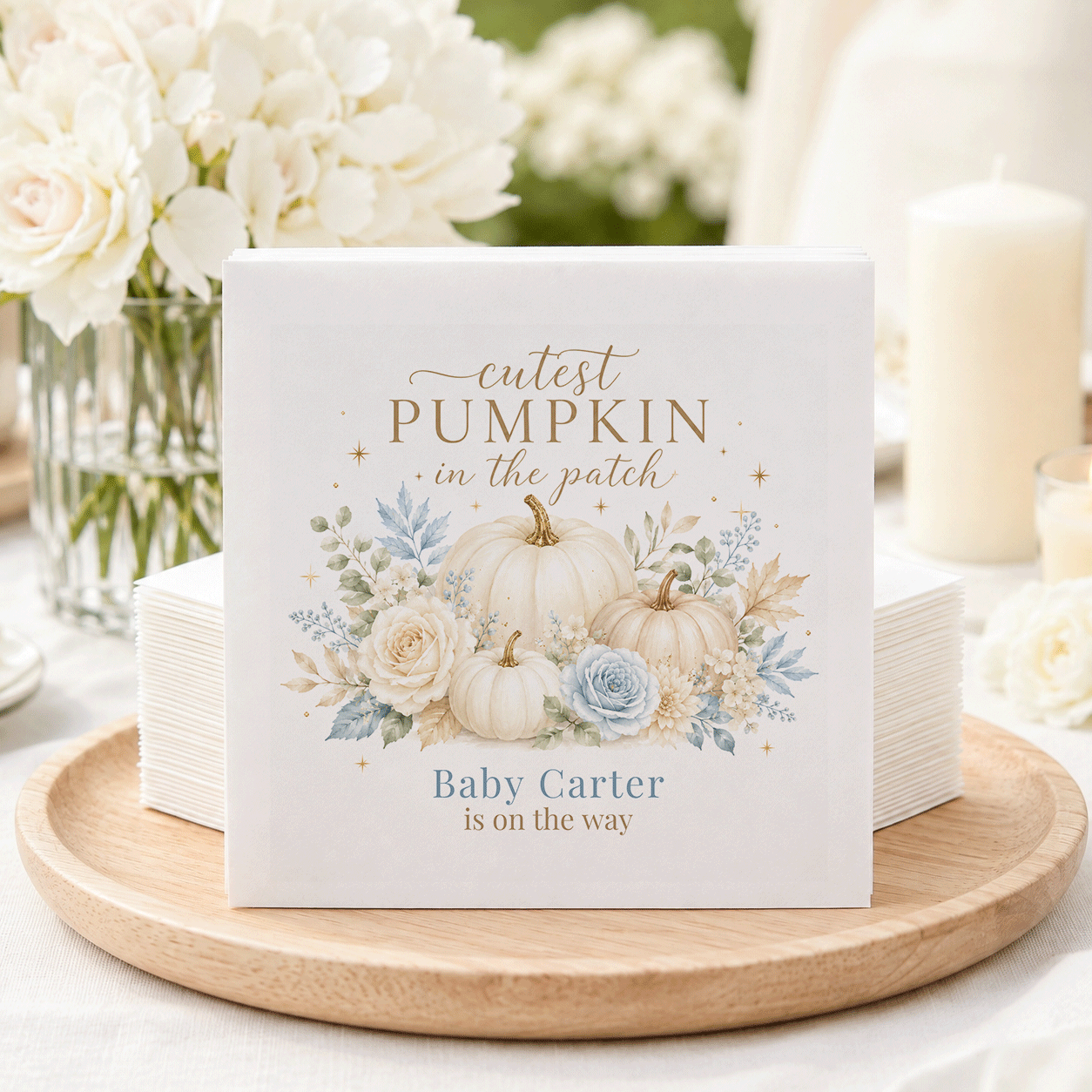 Napkins with pumpkins, flowers, and text "cutest pumpkin in the patch, Baby Carter is on the way."