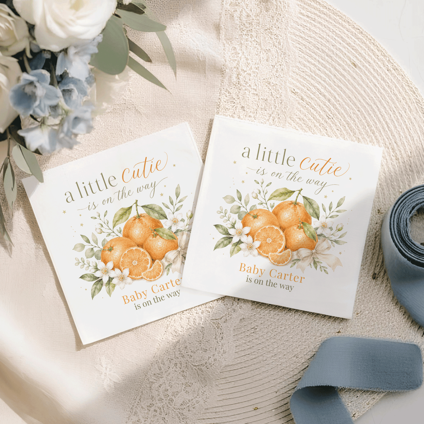 Two cards featuring oranges and text "a little Cutie is on the way."