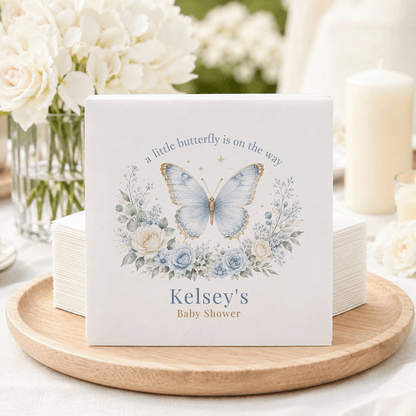 Kelsey's Baby Shower napkins feature a blue butterfly and floral design.
