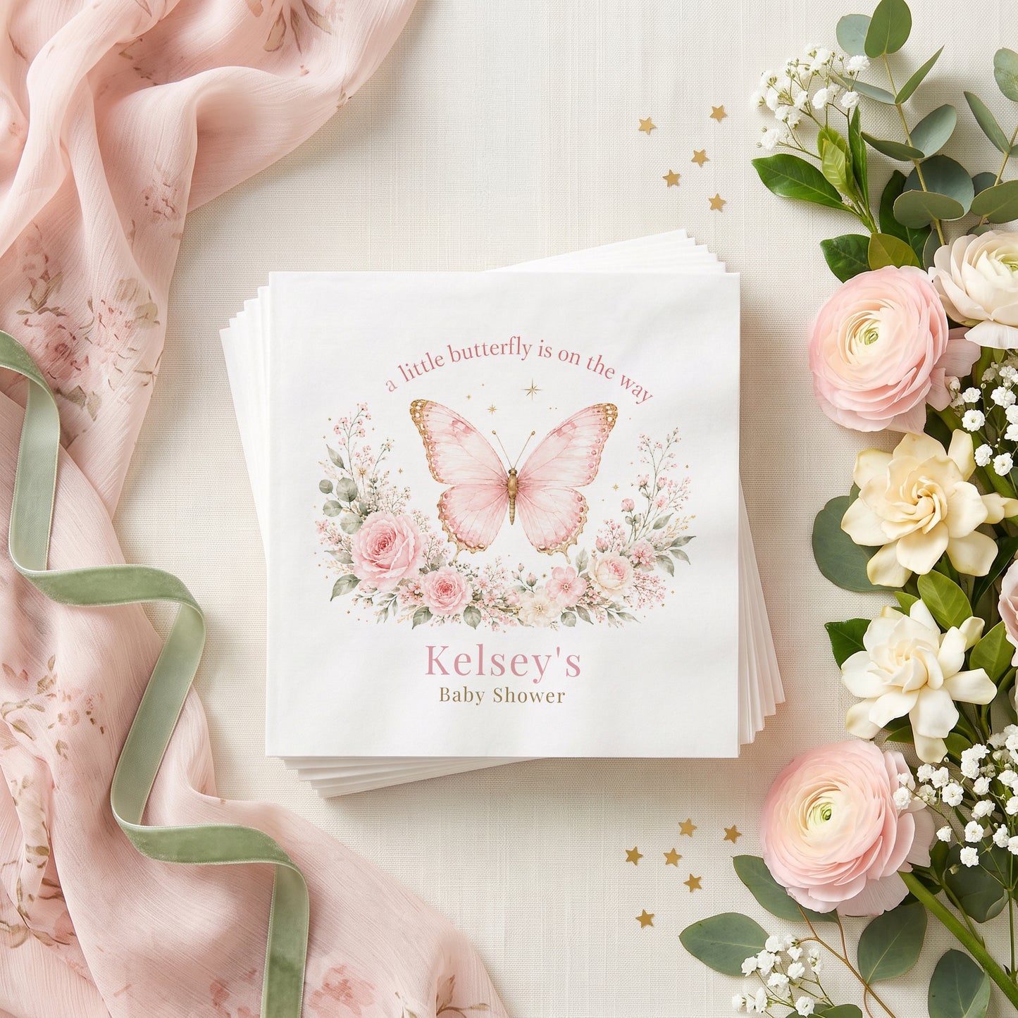 Blush pink butterfly baby shower napkin with gold edged wings, pink garden roses and a personalized name in dusty rose

