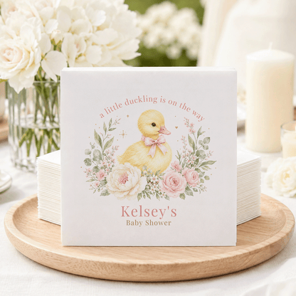 Kelsey's Baby Shower napkins feature a duckling illustration with the text "a little duckling is on the way."