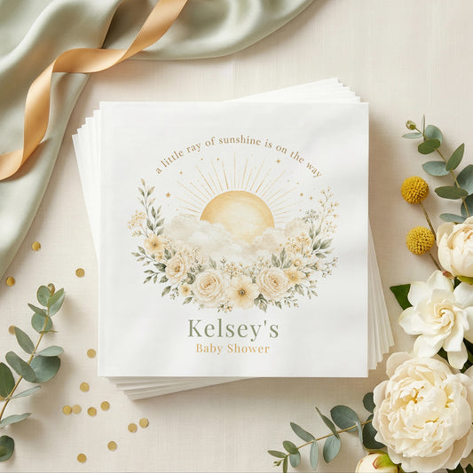 Cream and sage baby shower napkin with a golden sun, white clouds, ivory roses and a personalized name in sage green
