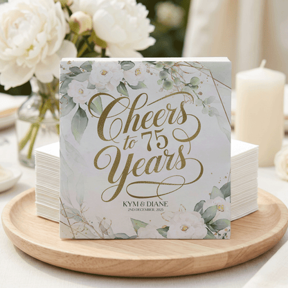 Cheers to 75 Years Kym & Diane on a card with floral and gold accents.