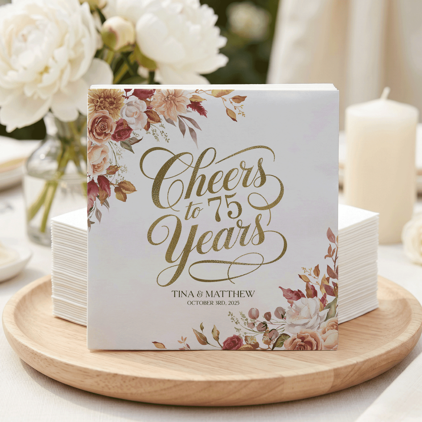 75th anniversary napkins with "Cheers to 75 Years" and floral design.