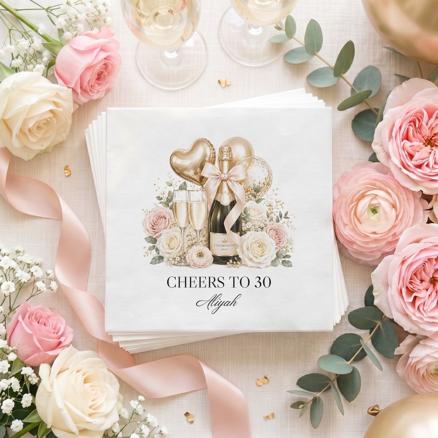 Personalized birthday napkins with champagne bottle, blush bow, floral arrangement, and Cheers to 30 custom wording