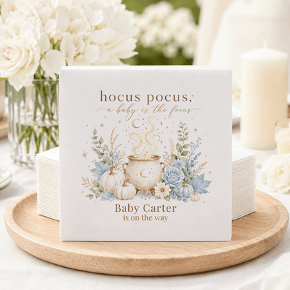 Napkins with "hocus pocus, a baby is the focus" and "Baby Carter is on the way."