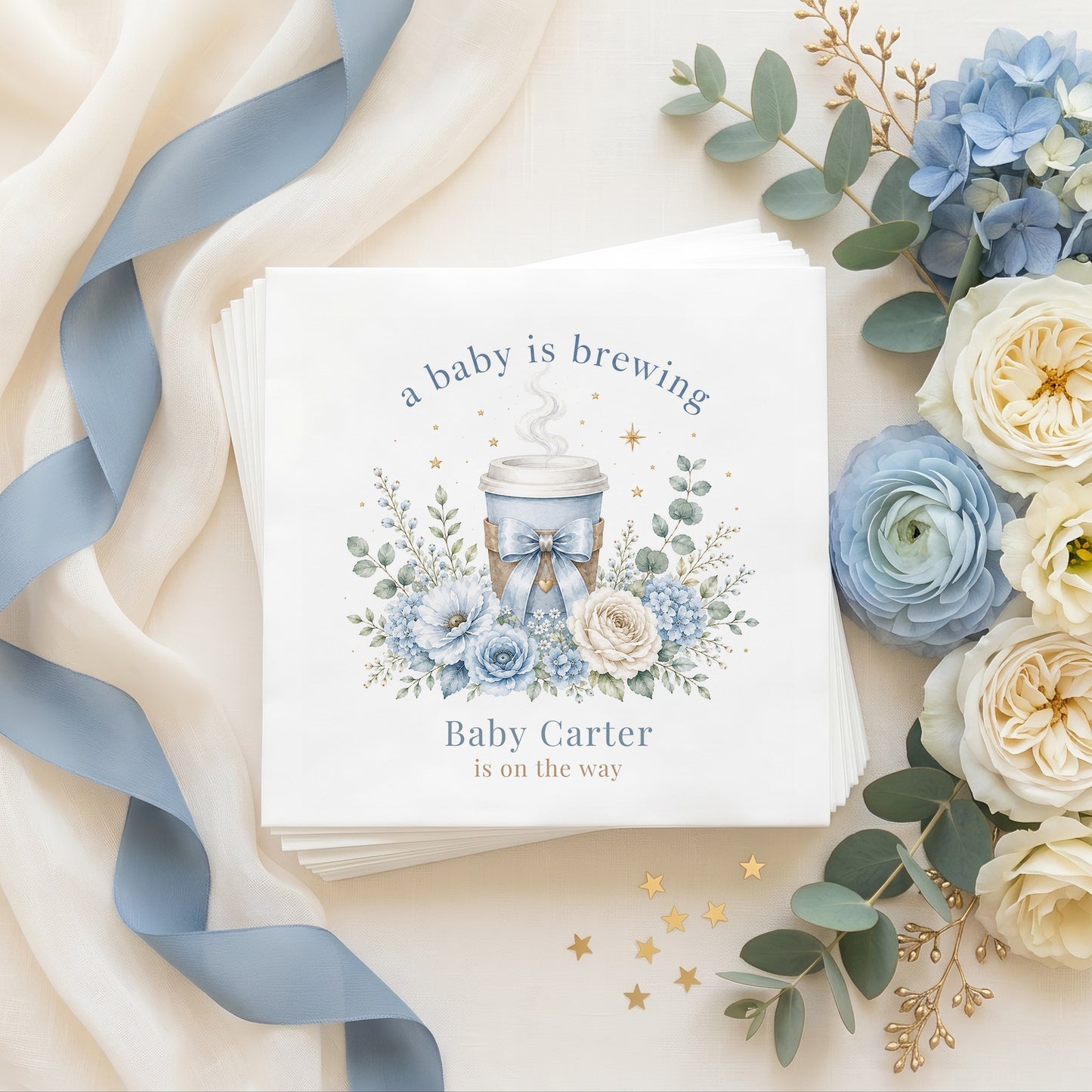 Personalized blue A Baby Is Brewing baby shower napkins with coffee cup, florals and custom baby name