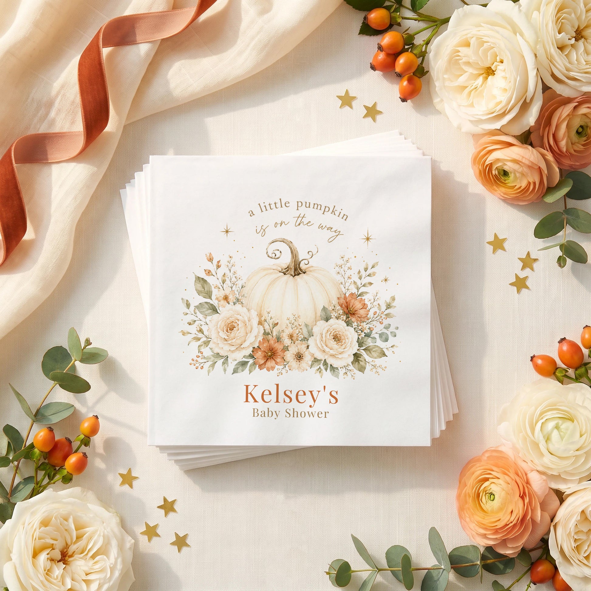 Cream and rust fall baby shower napkin with a pale pumpkin, ivory roses, rust cosmos and a personalized name in burnt orange