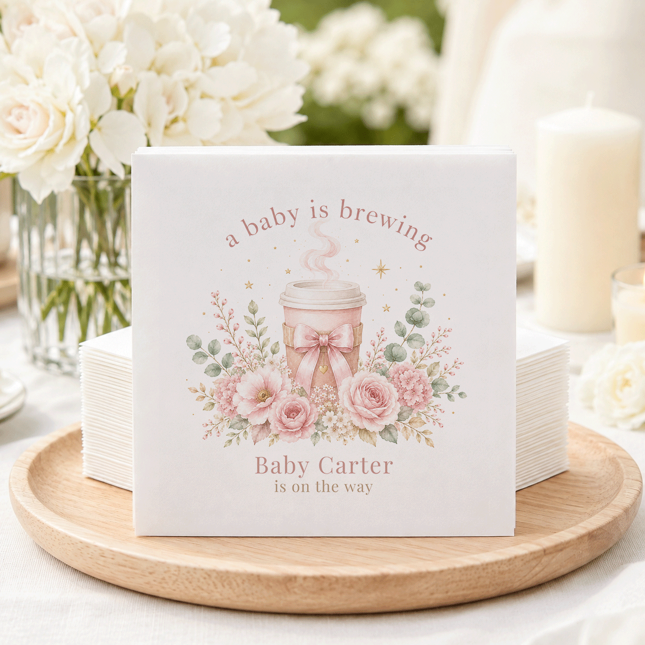 Baby shower napkins with "a baby is brewing" and "Baby Carter is on the way."