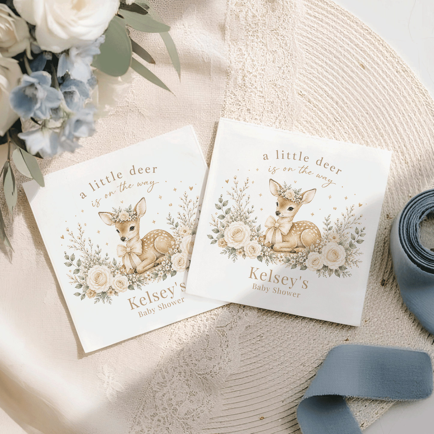 Two baby shower napkins with deer illustrations and "Kelsey's Baby Shower" text.