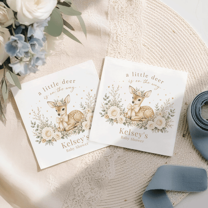 Two baby shower napkins with deer illustrations and "Kelsey's Baby Shower" text.