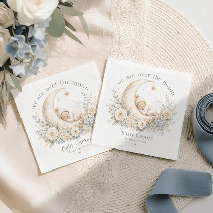 Two baby announcement cards with a sleeping baby on a crescent moon, text "Baby Carter is on the way."