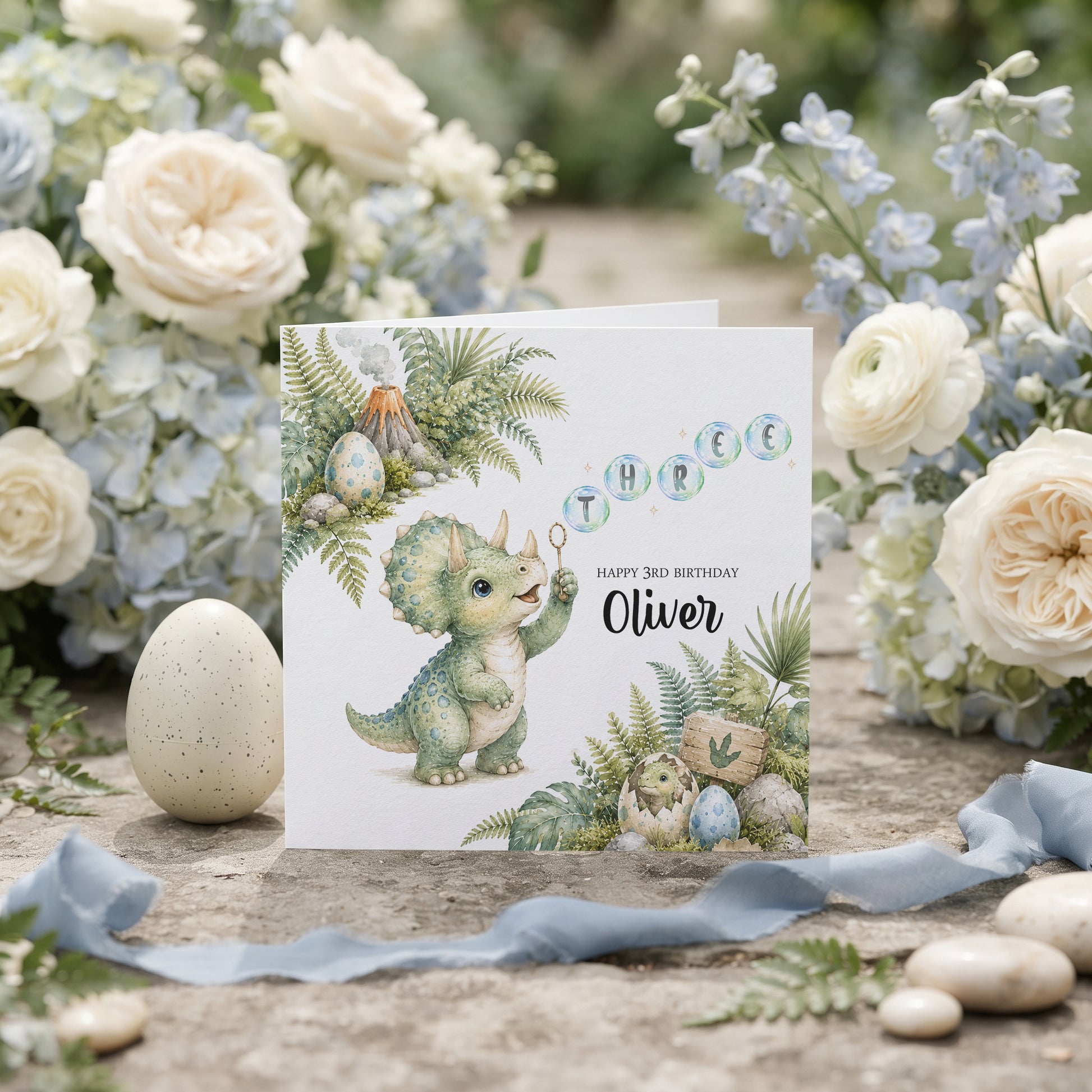 Personalized dinosaur 4th birthday card with baby triceratops and FOUR bubble lettering