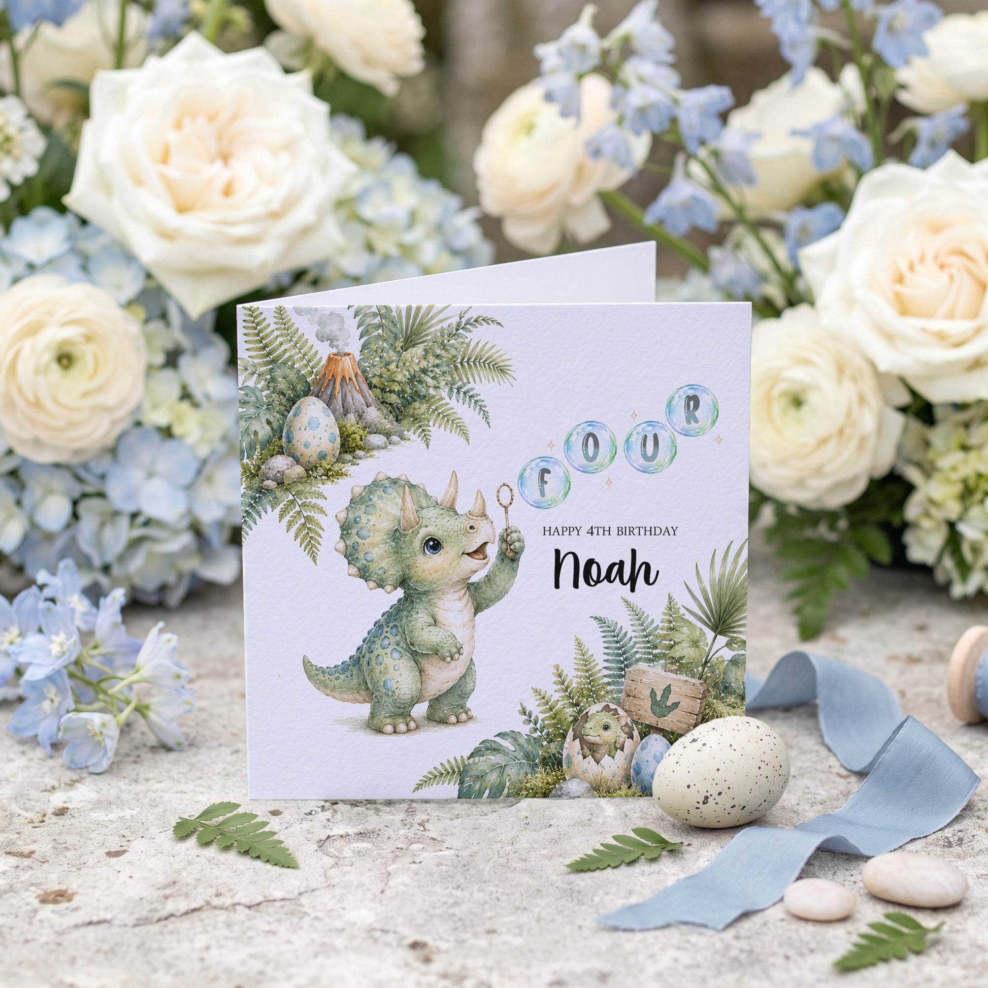 Personalized dinosaur 4th birthday card with baby triceratops and FOUR bubble lettering