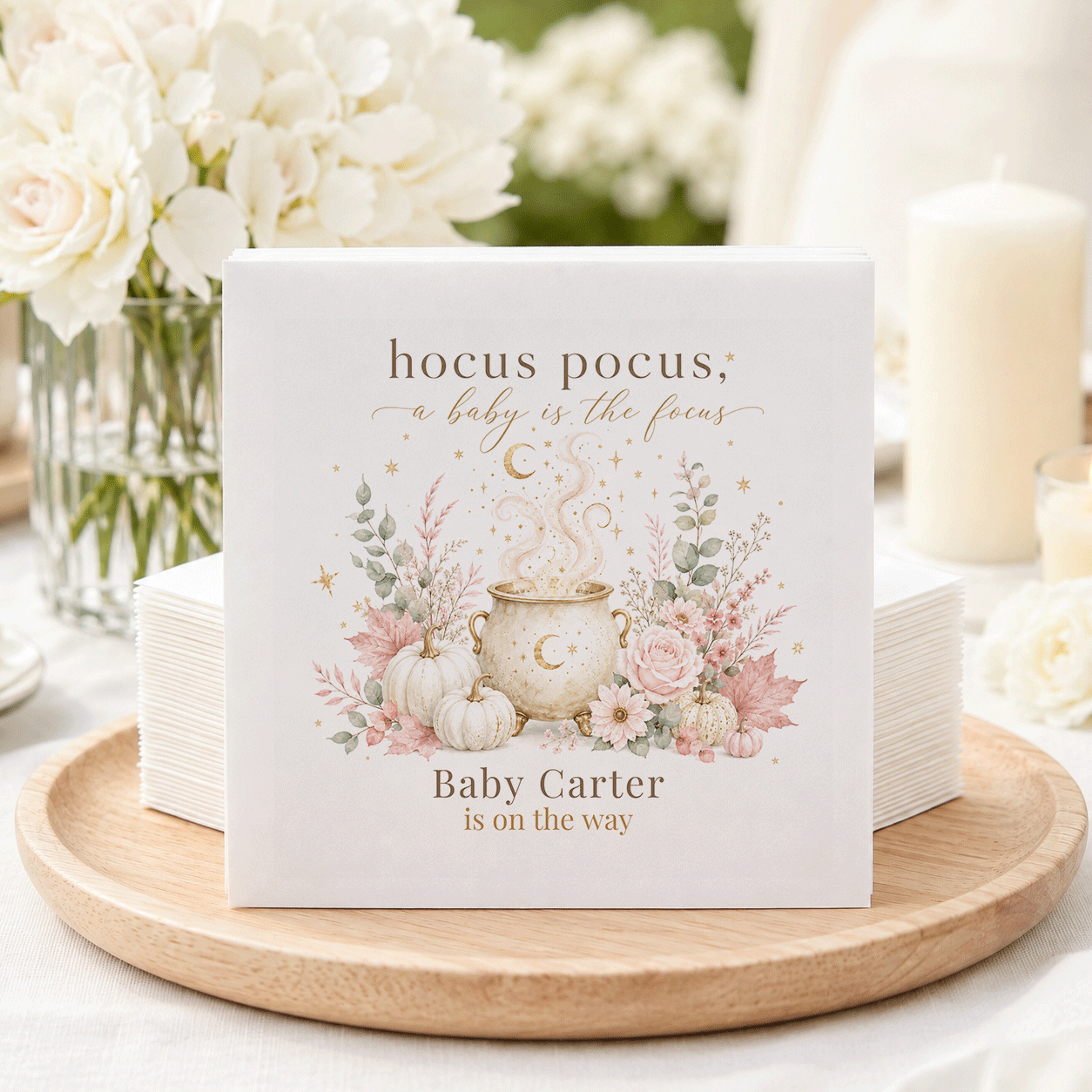 Napkins with "Hocus Pocus, A Baby is the Focus" and "Baby Carter is on the Way."