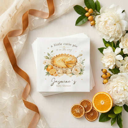 Cream and gold baby shower napkin with a golden pie, ivory peonies, citrus and personalized wording