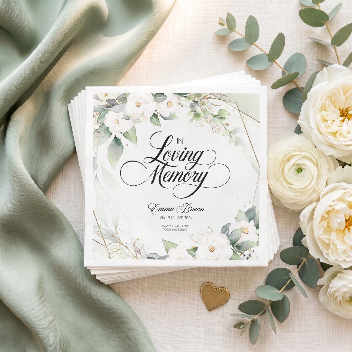 Personalized In Loving Memory napkins with white flowers, eucalyptus greenery, gold details and custom memorial wording