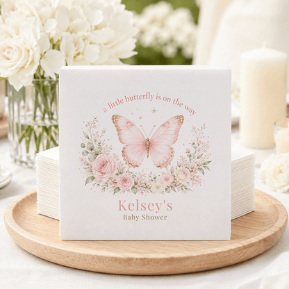 Baby shower napkins with pink butterfly and floral design, reading "Kelsey's Baby Shower".