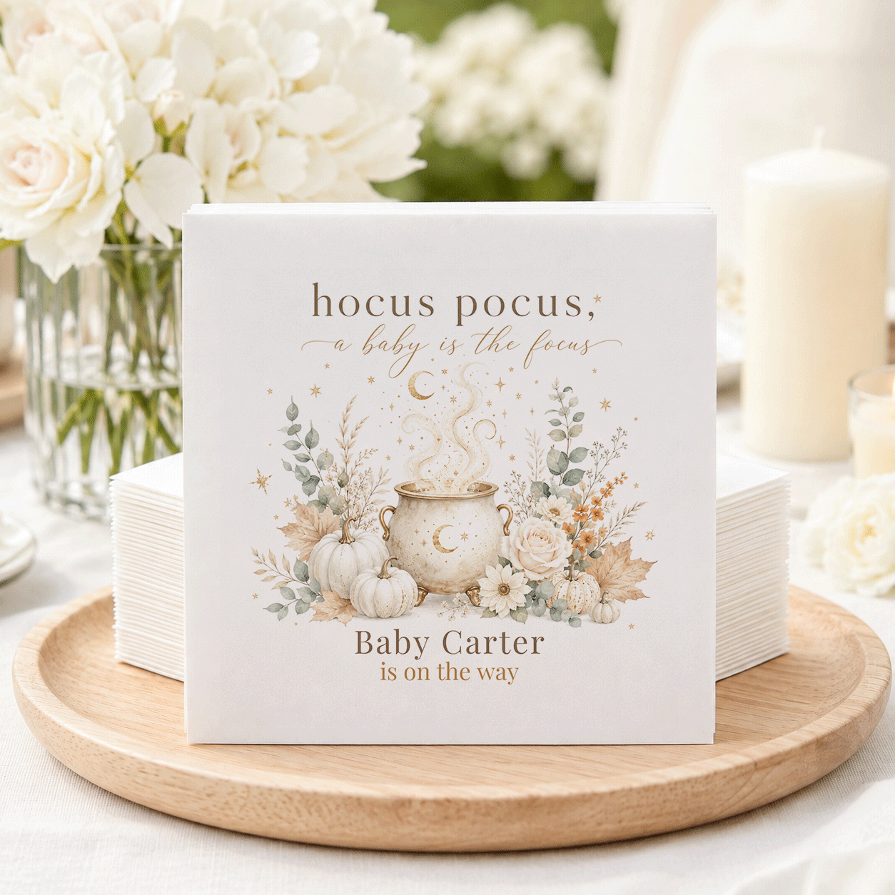 Napkins with "hocus pocus, a baby is the focus" and "Baby Carter is on the way".