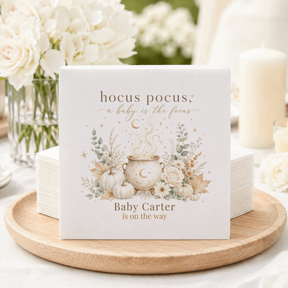 Napkins with "hocus pocus, a baby is the focus" and "Baby Carter is on the way".
