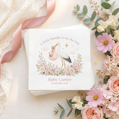 Personalized pink stork baby shower napkins with sleeping baby, blush florals and custom event wording