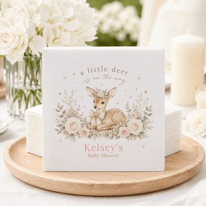 Kelsey's Baby Shower napkins featuring a fawn with flowers and text "a little deer is on the way."