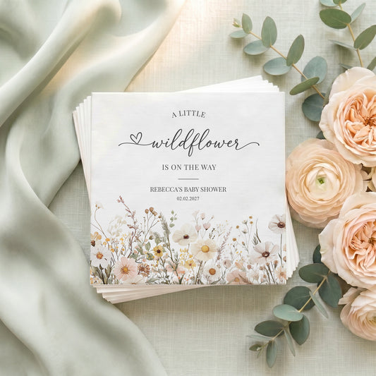 "A Little Wildflower" baby shower invitation with floral border, recipient's name, and date.