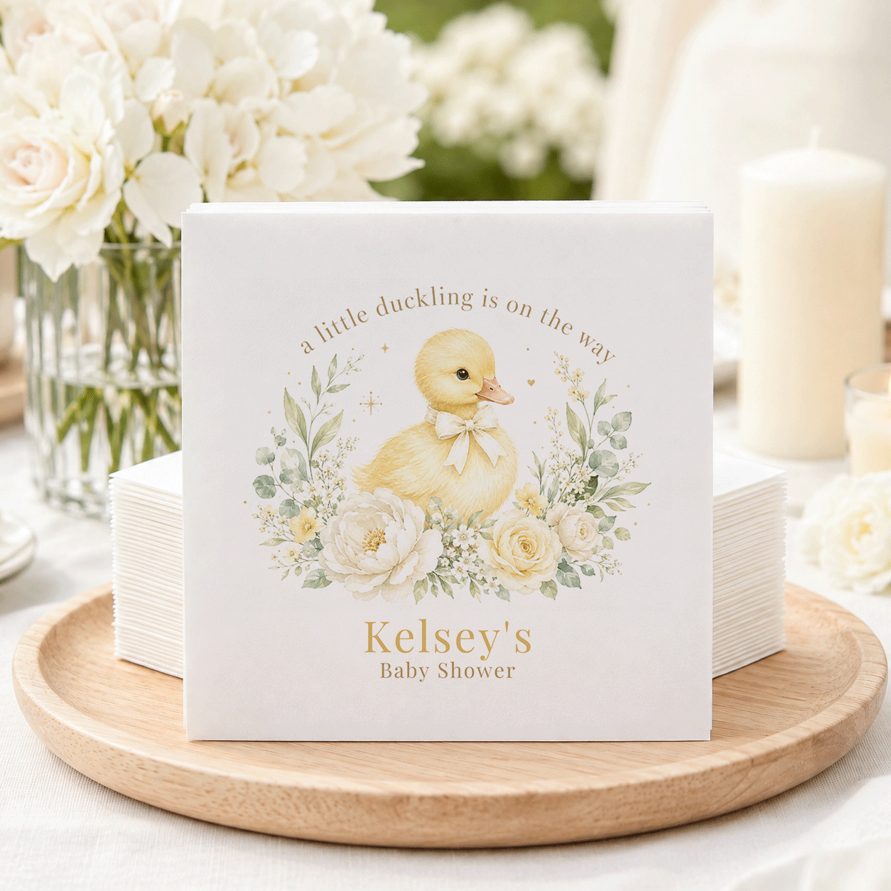 Napkins with a duckling graphic, "a little duckling is on the way," and "Kelsey's Baby Shower."