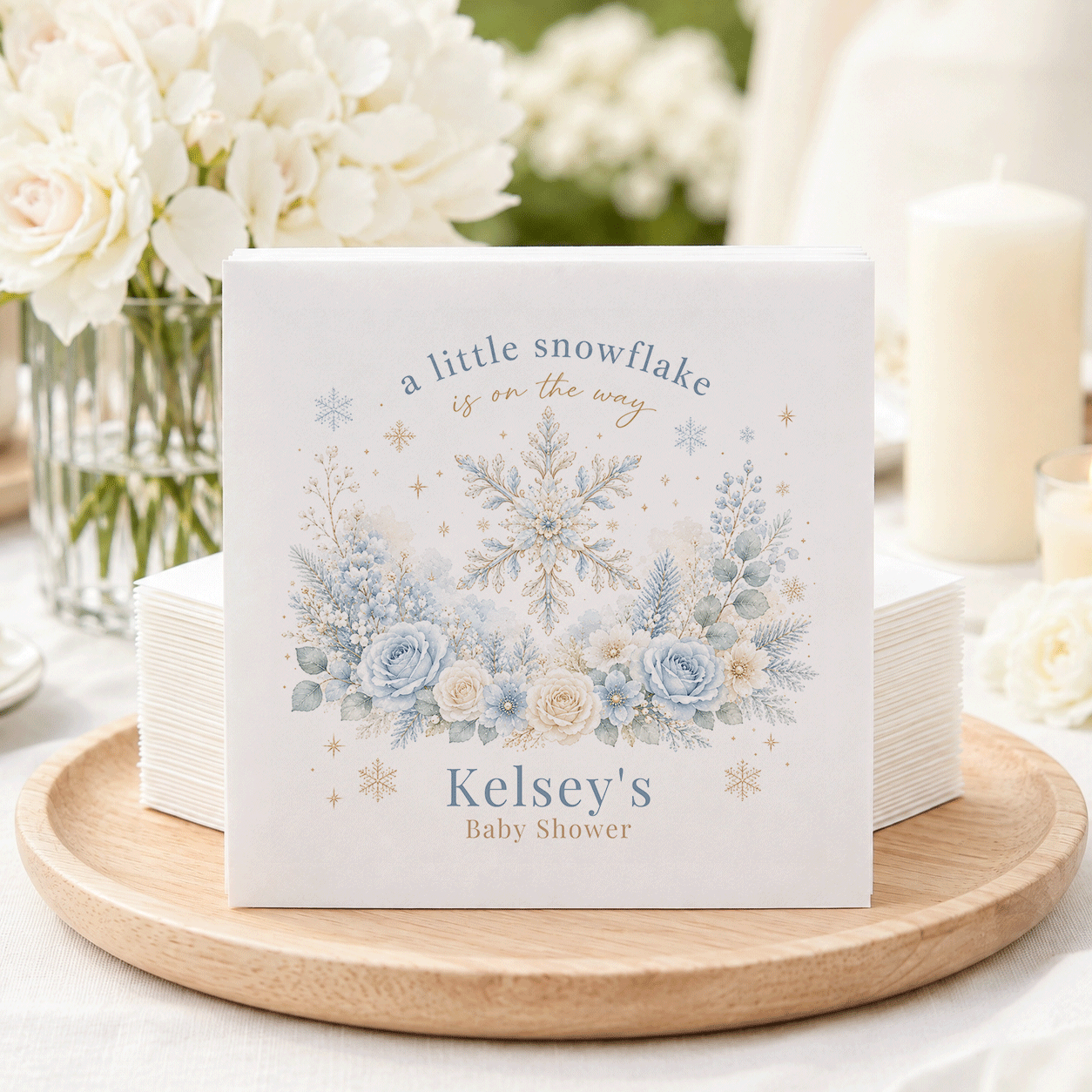 "A little snowflake is on the way" and "Kelsey's Baby Shower" text on a snowy floral card.
