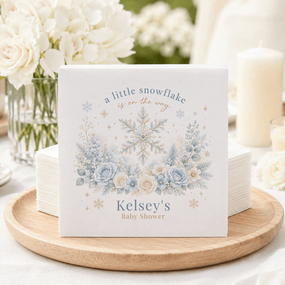 "A little snowflake is on the way" and "Kelsey's Baby Shower" text on a snowy floral card.