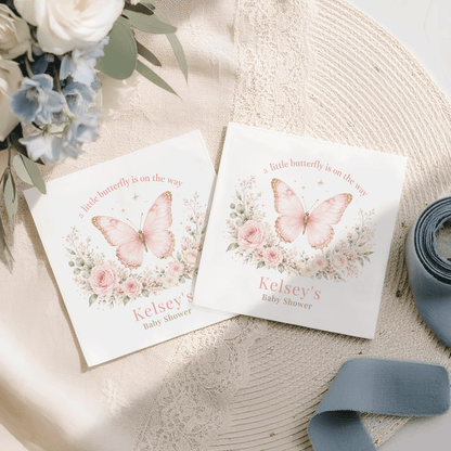 Two invitations with pink butterflies and floral designs for "Kelsey's Baby Shower."