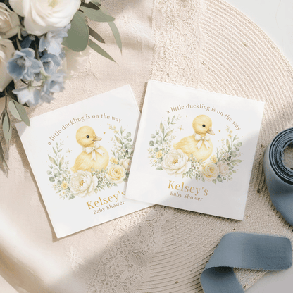 Two white cards with a duckling, flowers, and "Kelsey's Baby Shower" text.