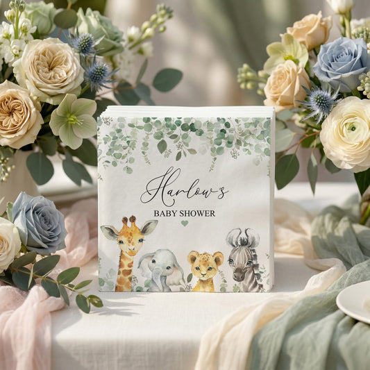 Baby shower napkins with giraffe, elephant, lion, and zebra illustrations.