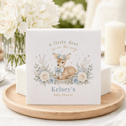 Baby shower napkins with a deer illustration and text "Kelsey's Baby Shower."