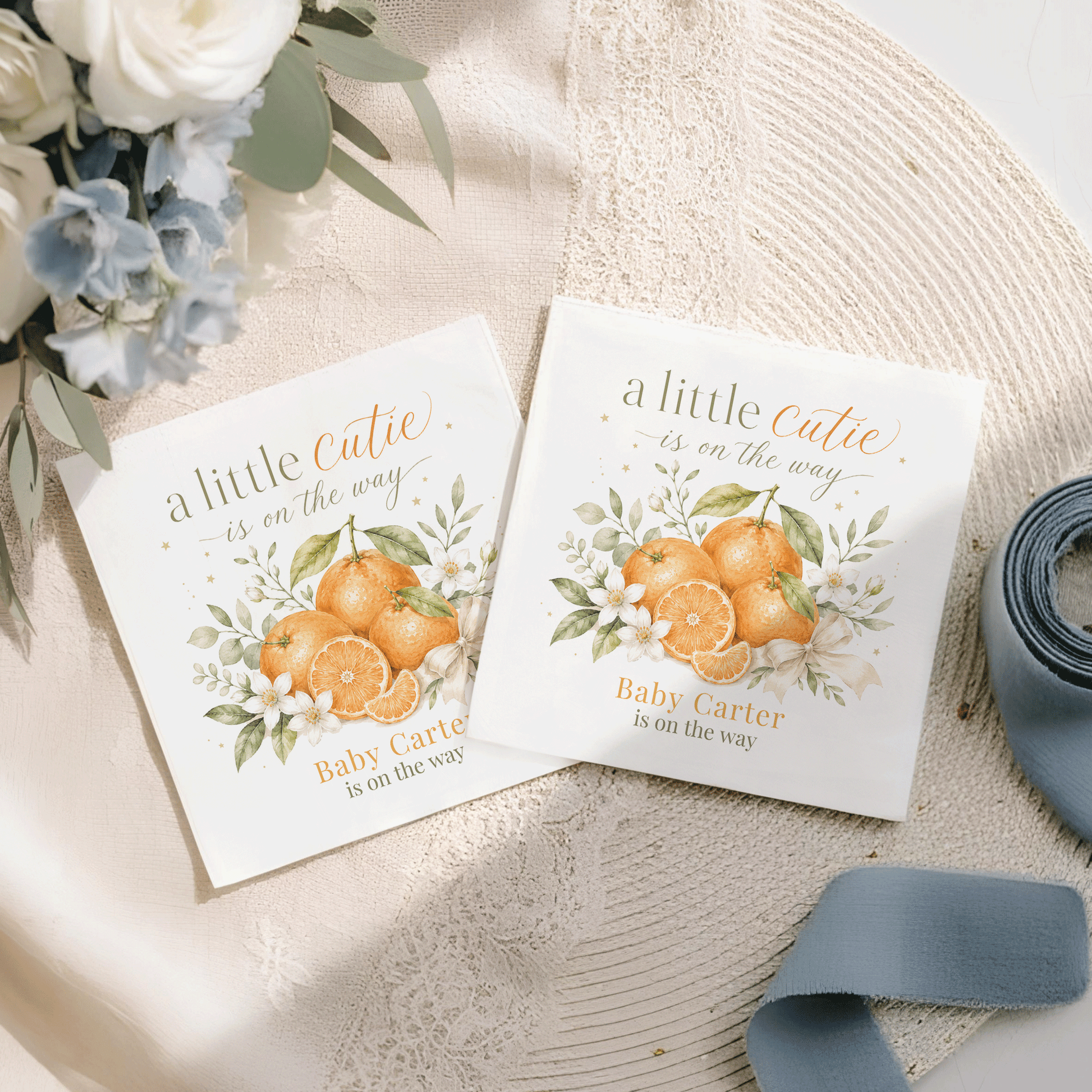 Two cards featuring oranges and text "a little Cutie is on the way."