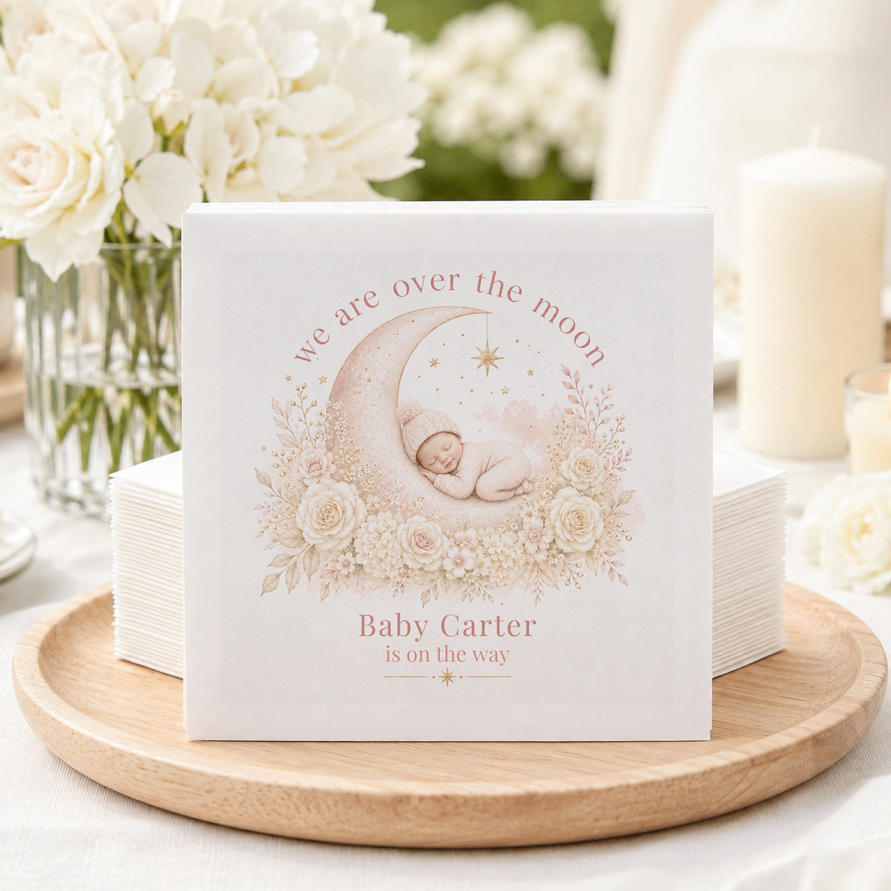 Napkins with a sleeping baby on a moon, "Baby Carter is on the way."