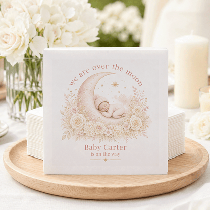 Napkins with a sleeping baby on a moon, "Baby Carter is on the way."