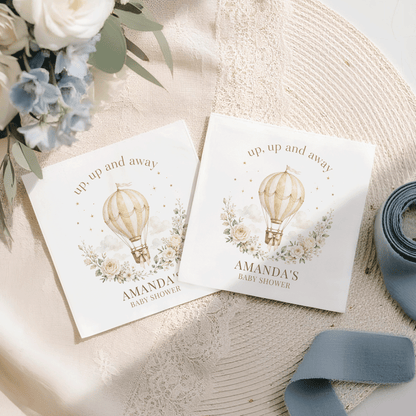 Two baby shower napkins with hot air balloon design and "Amanda's Baby Shower" text.