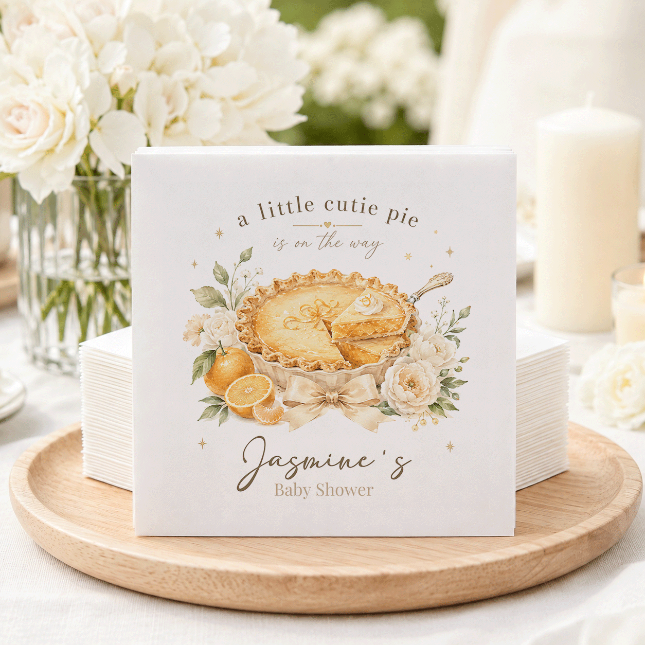 Baby shower napkins with "a little cutie pie is on the way" and "Jasmine's Baby Shower."