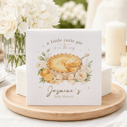 Baby shower napkins with "a little cutie pie is on the way" and "Jasmine's Baby Shower."