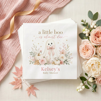 Blush pink baby shower napkin with a ghost in a pink bow, white pumpkins, pink roses and a personalized name