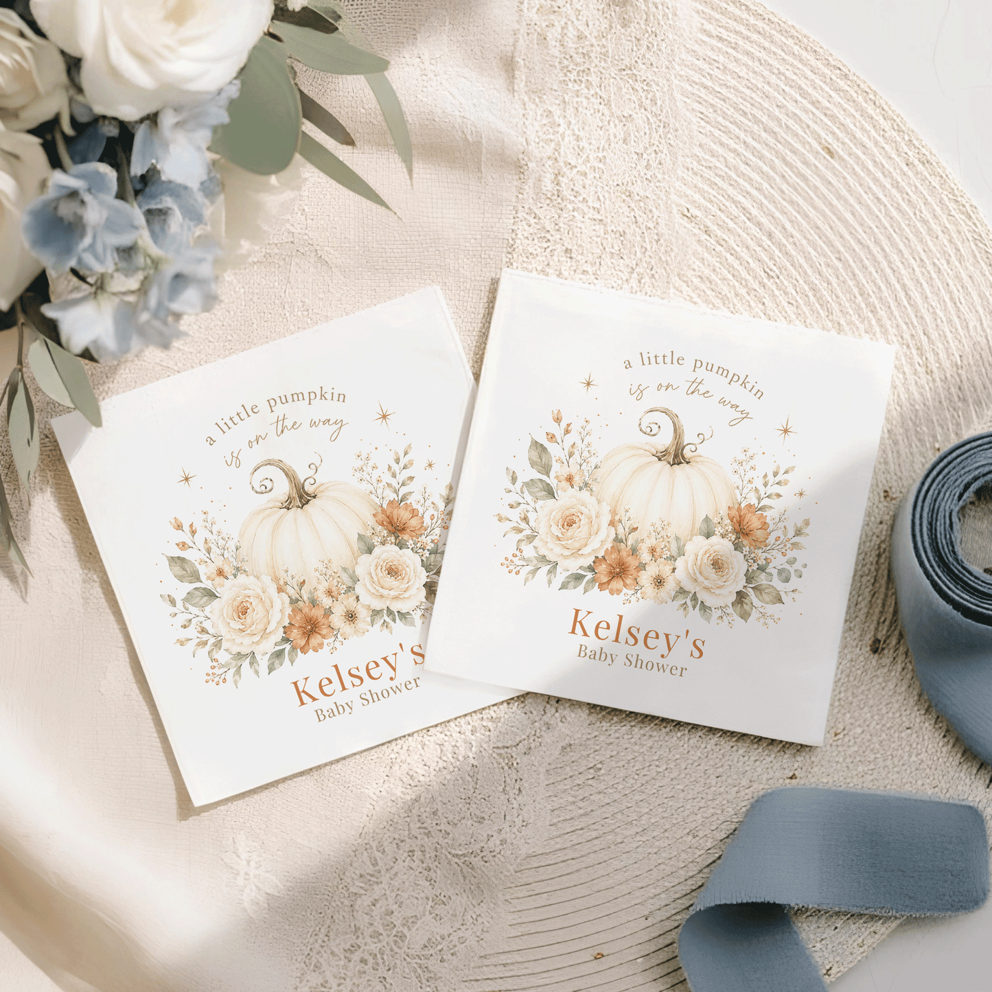 Two "a little pumpkin is on the way" baby shower napkins.