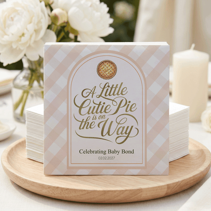Napkins with "A Little Cutie Pie is on the Way" and "02.02.2027" for baby bond celebration.