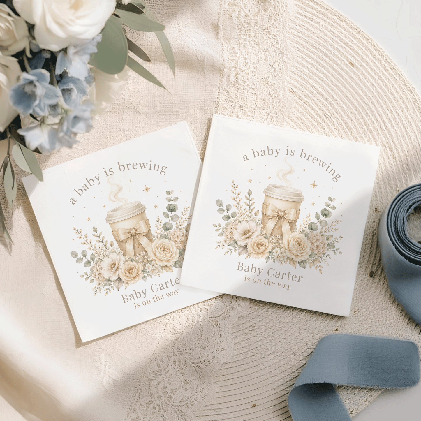 Two baby shower napkins with "a baby is brewing" and "Baby Carter is on the way" text.