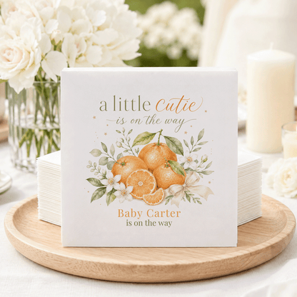 Napkins with "a little Cutie is on the way" and "Baby Carter is on the way".