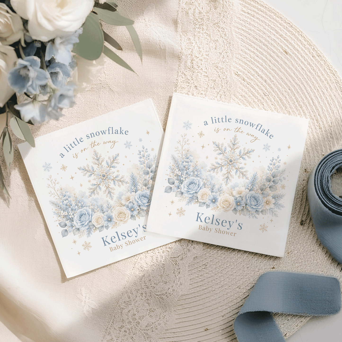 Two baby shower invitations with "A little snowflake is on the way" and "Kelsey's Baby Shower" text.