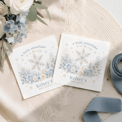 Two baby shower invitations with "A little snowflake is on the way" and "Kelsey's Baby Shower" text.